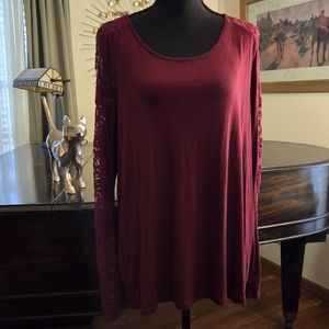 Deep rose colored top with lace accents.